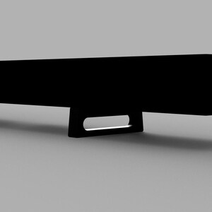 May include: A black rectangular soundbar with two small rectangular feet on each end.