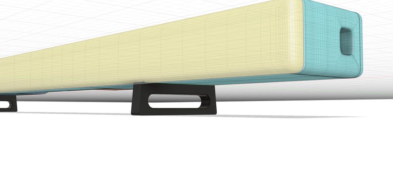 May include: A light blue and cream-colored soundbar with black feet. The soundbar has a rectangular shape and a slightly rounded edge. The soundbar is sitting on a white surface.