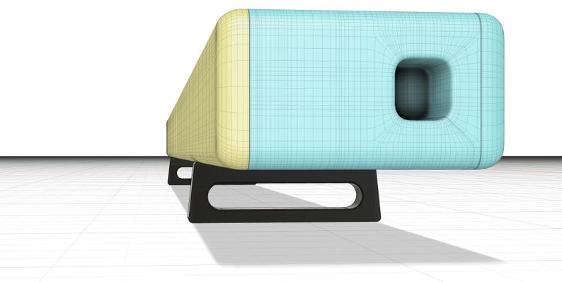 May include: A long, rectangular speaker with a light blue and yellow finish. The speaker has a black stand with two legs.