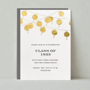 May include: A white invitation card with gold foil accents. The card features a string of gold foil circles hanging from a string. The text on the card reads "Please join us in celebrating Class of 1923 with fancy hors d'oeuvres and free career advice. Sunday, May 14th at 3 p.m. Princeton."