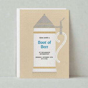 May include: An invitation card featuring a detailed illustration of a beer stein. The stein is white with a silver lid and handle, and gold accents. Text on the stein reads "Come share a Boot of Beer" and details for the Munich Oktoberfest.