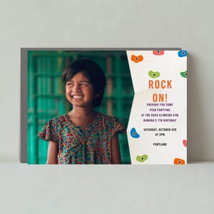 May include: A colorful invitation with a girl smiling in front of a green background. The invitation says "Rock On!" and invites guests to a rock climbing gym for a 7th birthday party. The party is on Saturday, October 6th at 3pm in Portland.