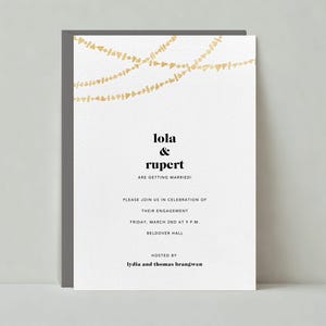 May include: A white wedding announcement card with gold string lights at the top. The text reads "lola & rupert are getting married!"  Please join us in celebration of their engagement. Friday, March 2nd at 9 p.m. Beldover Hall. Hosted by lydia and thomas brangwen.