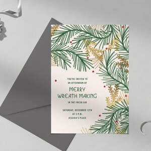 May include: An invitation card for a wreath-making event. The card features green and gold botanical illustrations with red accents. The text reads "You're invited to an afternoon of Merry Wreath Making in the fresh air, Saturday, December 12th at 2 P.M., Jessica's Place."