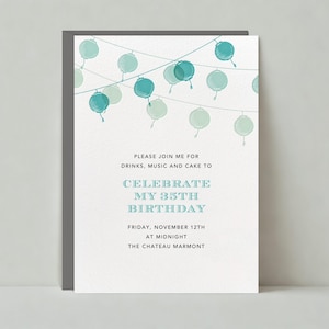 May include: A white invitation with blue watercolor string lights. The invitation reads "Please join me for drinks, music and cake to celebrate my 35th birthday. Friday, November 12th at midnight. The Chateau Marmont."