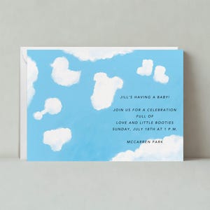 May include: A blue baby shower invitation with a cloud design and the text "JILL'S HAVING A BABY! JOIN US FOR A CELEBRATION FULL OF LOVE AND LITTLE BOOTIES SUNDAY, JULY 18TH AT 1 P.M. MCCARREN PARK"