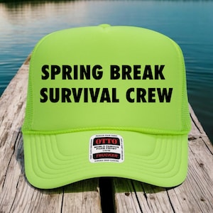 May include: A neon green trucker hat with the text "SPRING BREAK SURVIVAL CREW" in bold black letters. The hat has a mesh back and a curved brim. A small patch on the front reads "OTTO WORLD FAMOUS FOAM FRONT TRUCKER".