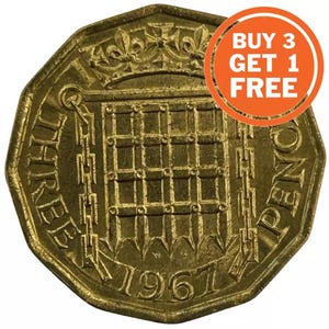 May include: A gold-colored three pence coin from 1967, featuring the Tower of London and the inscription "THREE PENCE".