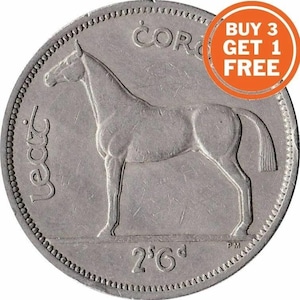 May include: A silver Irish 2.5 shilling coin featuring a horse standing on its hind legs with the inscription "Coróin" above and "Éire" below. The coin also has the year "2'6'd" printed on it.