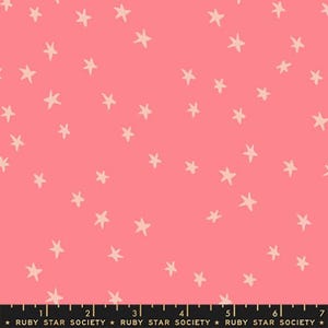May include: Pink fabric with a scattered pattern of off-white stars. The fabric has a smooth texture and is suitable for various sewing projects. The bottom of the fabric has the text "RUBY STAR SOCIETY".