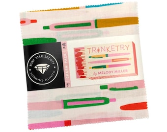 May include: A fabric charm pack featuring a repeating pattern of colorful pens on a white background. The pack includes a label with the text "Trinketry by Melody Miller" and a Ruby Star Society logo. The pack is 5 inches square and contains 42 pieces.