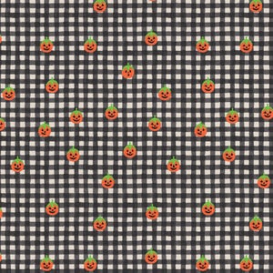 May include: A fabric pattern featuring a black and white buffalo check background with a repeating print of small orange jack-o'-lanterns. Each pumpkin has a green stem and a carved face with triangular eyes, a nose, and a jagged mouth.