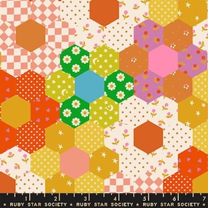 May include: A colorful fabric with a repeating hexagonal pattern. The design features various patterns within the hexagons, including polka dots, gingham, floral, and star motifs. The color palette includes orange, pink, green, yellow, and blue.