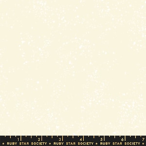 May include: A white fabric with a subtle speckled pattern, resembling a starry night sky. The fabric is a light cream color with tiny white dots scattered across the surface.