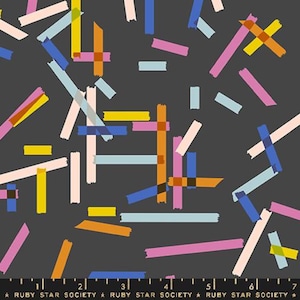 May include: A dark gray fabric with a repeating pattern of colorful, overlapping rectangular shapes. The rectangles are in shades of pink, yellow, blue, and orange. The text "RUBY STAR SOCIETY" is at the bottom.