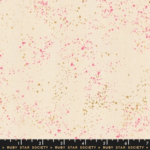 May include: A cream-colored fabric with a scattered pattern of pink and gold dots. The fabric is a cotton blend and is perfect for quilting, sewing, and crafting.