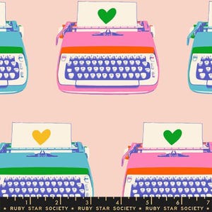 May include: A repeating pattern featuring colorful typewriters in shades of pink, blue, and green, set against a light pink background. Each typewriter has a sheet of paper with a heart symbol. The text "RUBY STAR SOCIETY" is at the bottom.