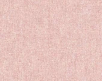 May include: A close-up of a pale pink fabric with a textured woven pattern.