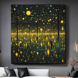 May include: Large framed artwork featuring a dark background with numerous yellow and gold lights, creating a sense of depth and a starry effect. The artwork is displayed above a white sectional sofa in a modern living room setting.