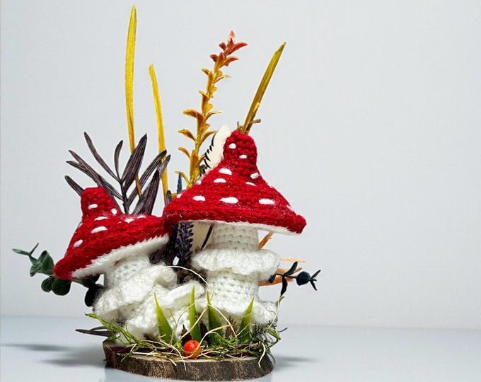 Decorative Red Fly Agaric Mushroom Toadstool Set on the Wooden Platform