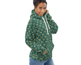 May include: A teal green hoodie with a white drawstring and a repeating pattern of gold Egyptian eyes.