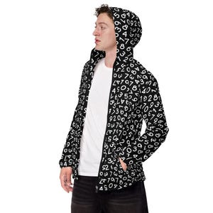 May include: Black zip-up hooded jacket covered in a pattern of white numbers. The jacket has a hood and pockets. The person in the image is wearing a white t-shirt underneath. The jacket is a unique and eye-catching piece of apparel.