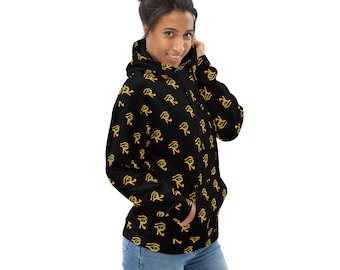 May include: Black hoodie with a repeating pattern of gold and green Eye of Horus symbols. The hoodie has a drawstring hood and a front pocket. The model is wearing blue jeans.