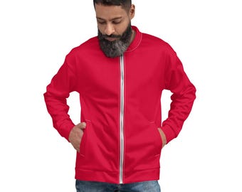 May include: A red zippered jacket with white stitching. The jacket has a stand-up collar and two pockets.