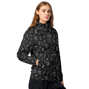 May include: A black zippered jacket with a white science-themed pattern. The pattern includes beakers, test tubes, molecules, and other scientific symbols.