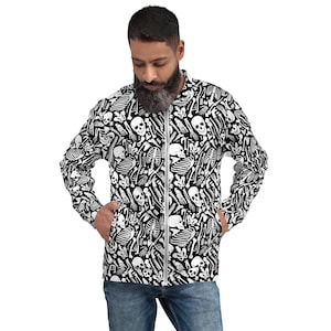May include: A black and white zip-up bomber jacket featuring a repeating pattern of white skulls and bones. The jacket has a silver zipper and two front pockets. The sleeves and body are covered in the bone and skull design.