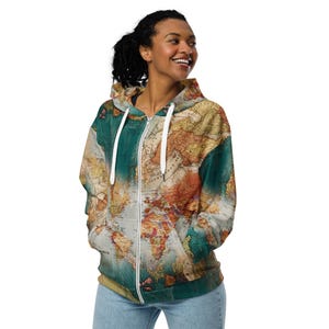 May include: A green, brown, and white zip-up hoodie with a vintage world map print.