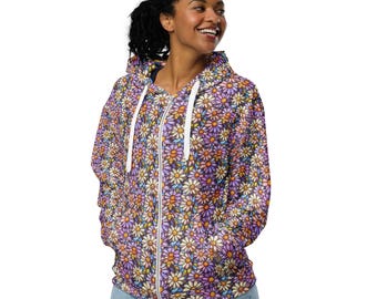 May include: A purple zip-up hoodie with a floral pattern featuring colorful daisies. The hoodie has a white zipper and a hood.
