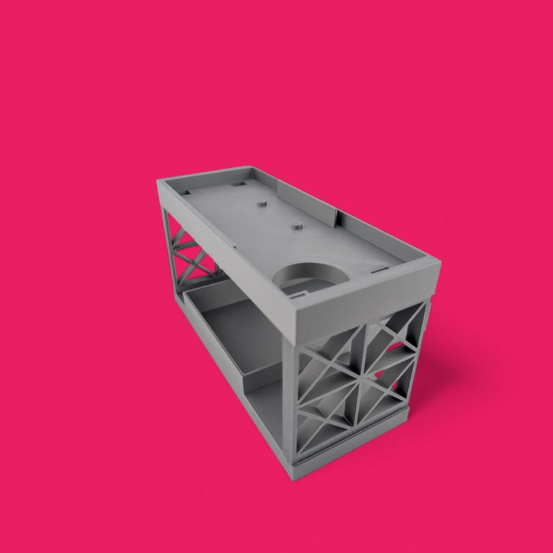 May include: A gray plastic storage organizer with a rectangular shape and a grid pattern on the sides. The organizer has two levels and a removable tray.
