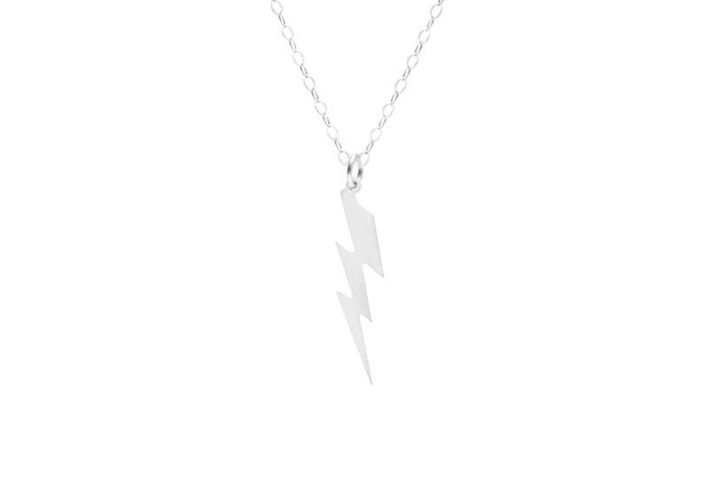 May include: A silver necklace with a lightning bolt pendant.