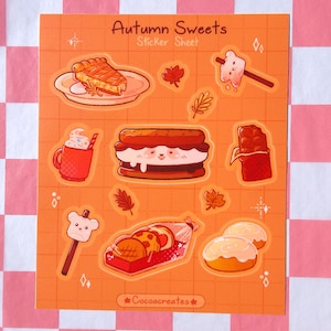 May include: An orange sticker sheet titled "Autumn Sweets" featuring illustrations of fall treats. Designs include a slice of pie, a mug of hot chocolate, a s'more, a chocolate bar, and other sweets. The sheet also includes fall leaves.