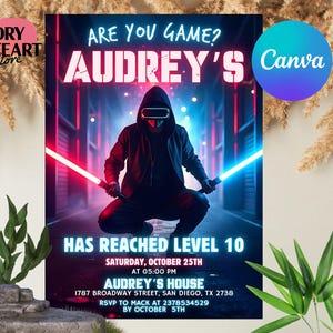 May include: A neon blue and red birthday party invitation for a girl named Audrey. The invitation features a person wearing a virtual reality headset and holding a lightsaber. The text reads "Are you game? Audrey's Has Reached Level 10".