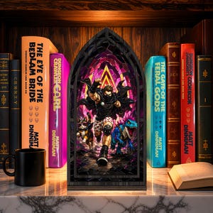 May include: A gothic-arched book nook insert featuring a central illustration of a masked character in a black cape and patterned shorts, accompanied by a cat and a blue dinosaur, set against a vibrant purple and yellow stained-glass background.