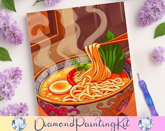 May include: A diamond painting kit featuring a vibrant illustration of a steaming bowl of ramen. The bowl is decorated with intricate orange and blue patterns and contains noodles, a soft-boiled egg, a red chili, and green leafy vegetables.