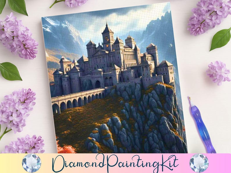 May include: A diamond painting kit featuring a detailed illustration of a castle atop a rocky cliff, with a bridge and towers. The artwork is set against a backdrop of mountains and a blue sky. The words "Diamond Painting Kit" are at the bottom.