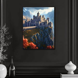 May include: A framed canvas print of a castle perched atop a rocky cliff, with a bridge leading to the castle. The artwork features a mountain backdrop and autumn-colored trees. The castle is gray, and the sky is blue.