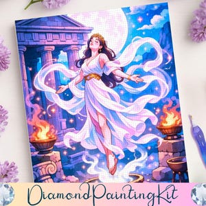 May include: Diamond painting kit featuring a celestial illustration of a woman in a flowing white gown with a gold crown, set against a backdrop of ancient architecture, flames, and a full moon. The kit includes a stylus and a diamond-shaped gem.