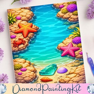 May include: Diamond Painting Kit featuring a vibrant beach scene. The artwork depicts a turquoise ocean, sandy shore, and colorful sea life, including starfish, a crab, and seashells. The kit includes a stylus and is surrounded by lilac flowers.