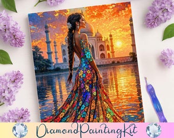 May include: A diamond painting kit featuring a woman in a colorful dress standing in front of a white building with a sunset in the background.