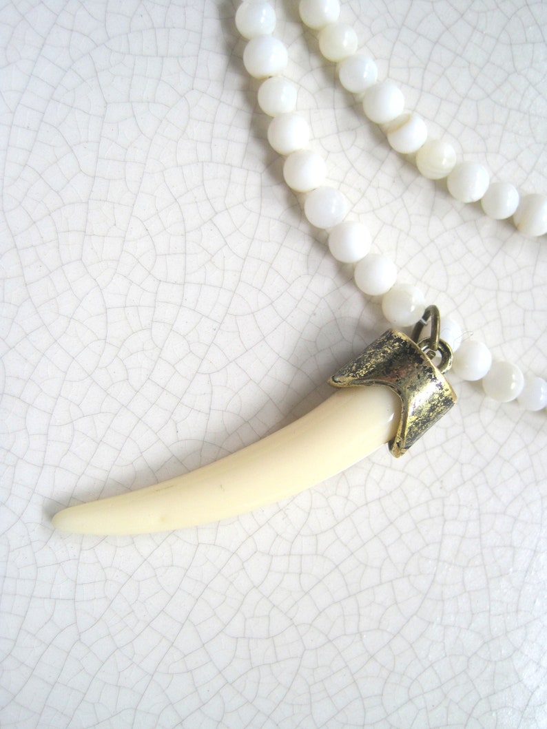 shell beads double strand necklace with faux ivory pendant