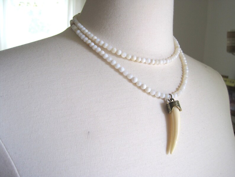 shell beads double strand necklace with faux ivory pendant