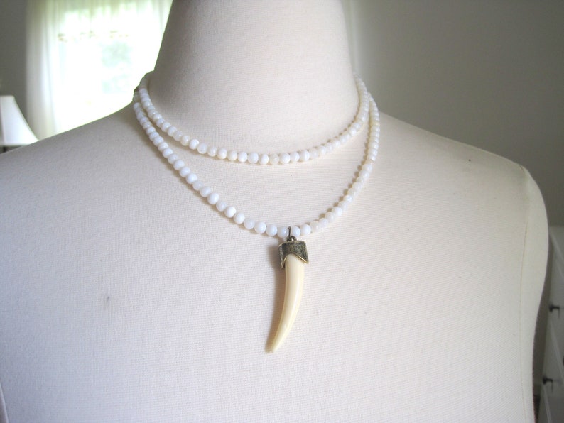 shell beads double strand necklace with faux ivory pendant