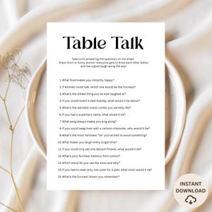 May include: A white printable game sheet titled "Table Talk" with questions to spark conversation. The sheet includes prompts like "What food makes you instantly happy?" and "What's the silliest thing you've ever laughed at?"