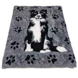 May include: A rectangular dog bed with a grey background and black paw prints. The bed features a black and white dog illustration in the centre. The dog is sitting with its tongue out. The bed is made of a soft, plush material.