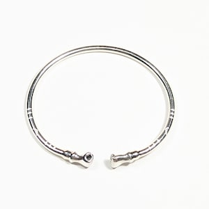 FREE Gift with purchase of 35 dollars or more. Sterling Silver Fist Bangle