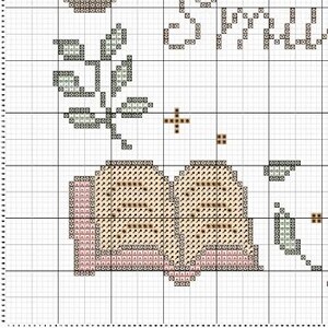 May include: A cross-stitch pattern featuring a closed book with a pink spine and brown pages, surrounded by green leaves and a small brown cross.